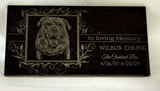 Memorial plaque for a dog named Wilbur Chunk with a black and white photo and engraved text.